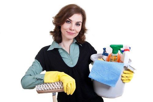 Local technician treating pet urine stains in a Docklands apartment
